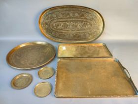 A collection of oriental & Persian brass trays & dishes