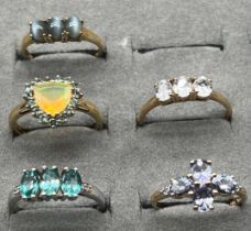 Three 10ct gold and two 9ct gold rings fitted with various gem stones; Ethiopian opal, tiger eye