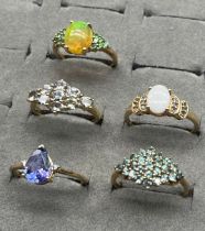 A Lot of five various 9ct & 10ct yellow gold and gem stone rings; White and Ethiopian opals. [9ct-