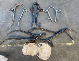 A collection of antique horse yoke harnesses