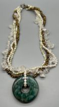 A Ladies necklace- made up of fresh water pearls, Quartz and Nephrite green jade turned pendant.