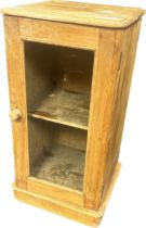 Antique Pitch pine cabinet, the glazed door opening to shelved interior [75x38x36cm]