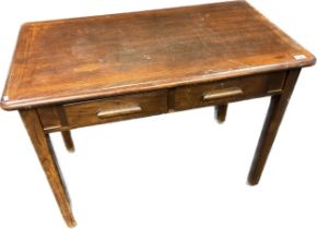 Mid century oak desk, two short drawers, raised on square tapered legs