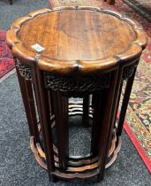 Antique Chinese nest of four rosewood graduating tables of circular form. [64cm high, 44cm diameter]