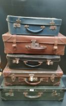 A collection five vintage varying suit cases