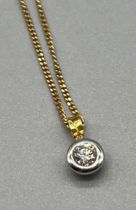 18ct yellow and white gold pendant fitted with a round cut 0.36ct diamond, Together with an 18ct