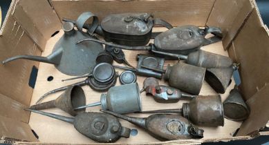 A collection of vintage oil cans includes braim oil can