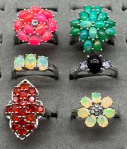 A Lot of six 925 silver, Ethiopian opal, fire opal and opalescent stone rings.