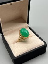 9ct yellow gold ring set with a large green stone cabochon. [Ring size N] [7.22Grams]