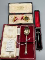 Three various boxed items; Silver and blue john stone pin, Sheffield silver tea spoon by Francis