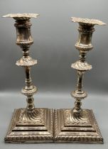 A Pair of Edwardian silver plated candle sticks. [29cm high]