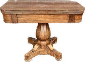 Early 19th century mahogany table, the D-shaped flip top pivoting to extend above a baluster