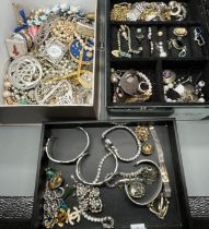 A Large collection of jewellery; Raymond Weil ladies watch, Silver and CZ Bracelet, Jade cross