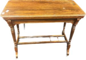 19th century rosewood swivel flip top table opening to a green material surface area, raised on
