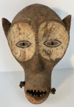 An antique African carved tribal zande or Nzakara mask [40x28cm]