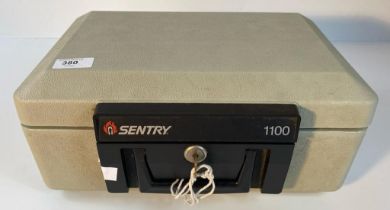 A sentry model 1100 security box with key [36x25cm]