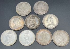 A Lot of nine silver crowns; 1695 & 96 crowns. Seven Queen Victoria Crowns- 1887, 1889, two 1890,