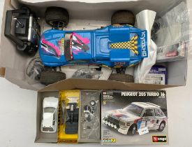A Remote control car with remote along with Peugeot 205 turbo airfix model boxed