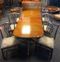 Reproduction of an Antique 19th century Mahogany dining table with six open splat back chairs. Comes