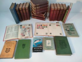 A box of antique books & two stamp albums of stamps; dickens stories & other books