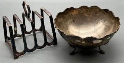 Two items of silver; 800 grade three foot sugar bowl and a Sheffield silver four slice toast rack.