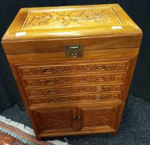 Oriental Rosewood cutlery unit. Lift top section, four drawers and two doors. [82x56x35cm]