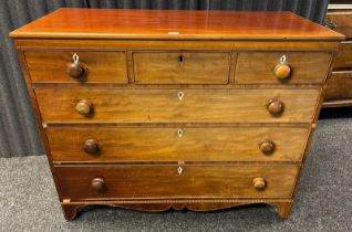 Large 19th century chest of drawers; three short drawers over three long drawers. Raised on