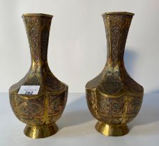A Pair of Cairo ware brass vases in Arabic design with silver inlays [25cm]