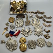 A Collection of Military Cap and collar badges. Also the lot contains military buttons and various