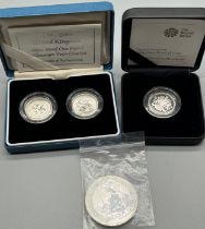 Two boxed silver coin sets and silver loose coin; Britannia 2020 one ounce 999 fine silver two pound