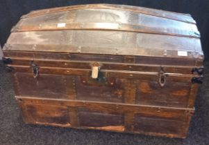 19th century Saratoga dome top trunk. Wood and metal bound. Leather lifting handles to each side. [