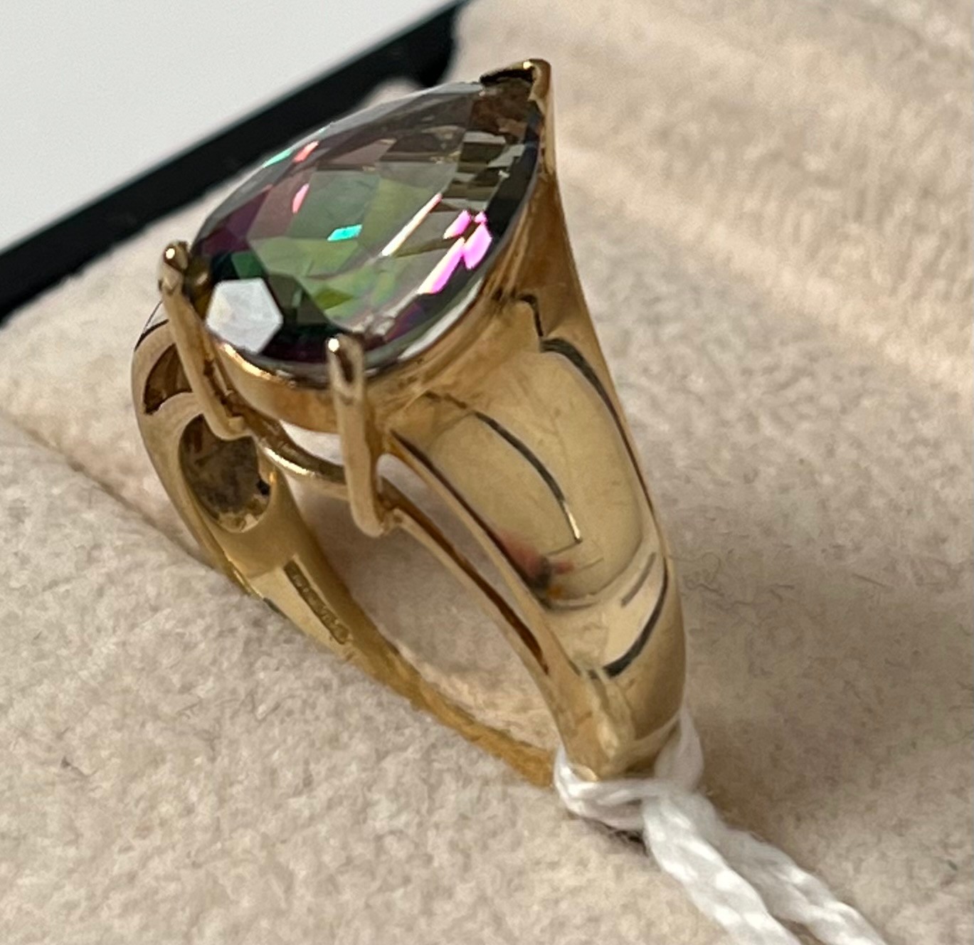 9ct yellow gold ring set with a pear drop green/ purple coloured gem stone. [Ring size N] [5.