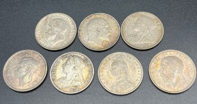 A Lot of seven silver half crowns; Queen Victoria-1887, 95 & 1900. Edward VII- 1902. George V-