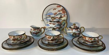 A Japanese Kutani egg shell design tea service, hand painted land and mountain scape & silhouette