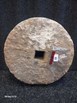 Antique stone carved wheel. [35cm diameter]