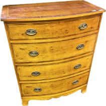 Yew Wood reproduction bow front chest of drawers. Four drawers and raised on bracket feet. [