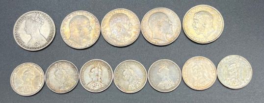 A Selection of Silver coins; Seven Shillings; three 1910 Florin; Gothic type florin 1873; Florin