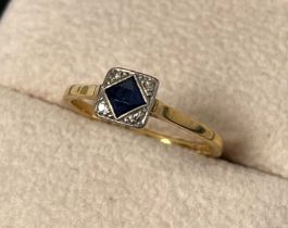 Art Deco style 18ct gold & Platinum ring set with a Princess cut sapphire flanked by four round