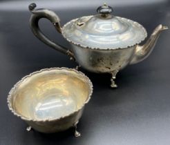 Birmingham silver tea pot and matching sugar bowl. Produced by E.S. Barnsley & Co. Raised on three