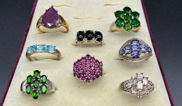 A Lot of eight 925 silver and gem stone rings; Blue topaz, tourmaline and amethyst.