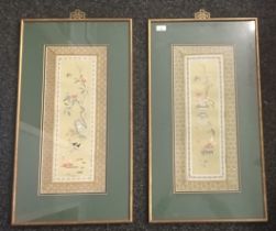 Pair of Japanese needlework's on silk, within material and card mounted surrounds [81x45cm]