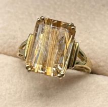 9ct yellow gold ring set with an unusual gem stone, gold veins throughout. [Ring size N] [3.64Grams]