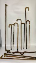 A collection of antique shepherds crooks & walking sticks; 18ct gold plated mounted walking stick, 2
