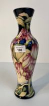 A Moorcroft tulip design Vase, 7/30 signed with maker to base [31cm]