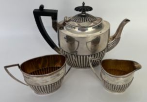 Three piece Sheffield silver tea service; tea pot, cream jug and sugar bowl. Produced by Walker &