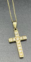 9ct yellow gold and round cut stone cross pendant together with a 9ct gold chain. [2.51grams]