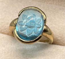 9ct yellow gold ring set with a blue topaz cabochon gem stone. [Ring size N] [5.02Grams]