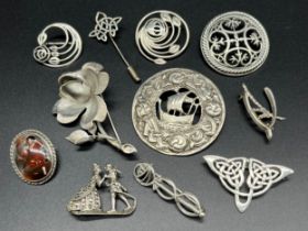 A Collection of silver brooches and pins; 925 silver ornate pierced Ortak style brooch/ pendant,