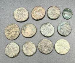 A Collection of 12 Antique Bronze Roman/ Greek Coins.