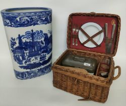 A vintage picnic set in fitted wicker basket along with an Ironstone blue & white umbrella stand